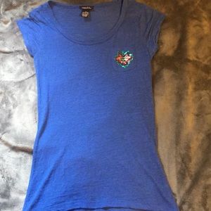 vibrant blue top with designed pocket